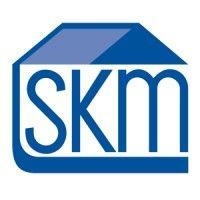 skm title & closing services, p.c. logo image