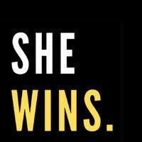 she wins logo image