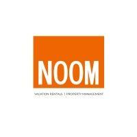 noom vacation rentals |  property management logo image