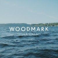 the woodmark hotel & still spa logo image