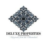 deluxe properties real estate inc. logo image