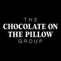 the chocolate on the pillow group logo image