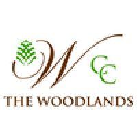 woodlands country club logo image